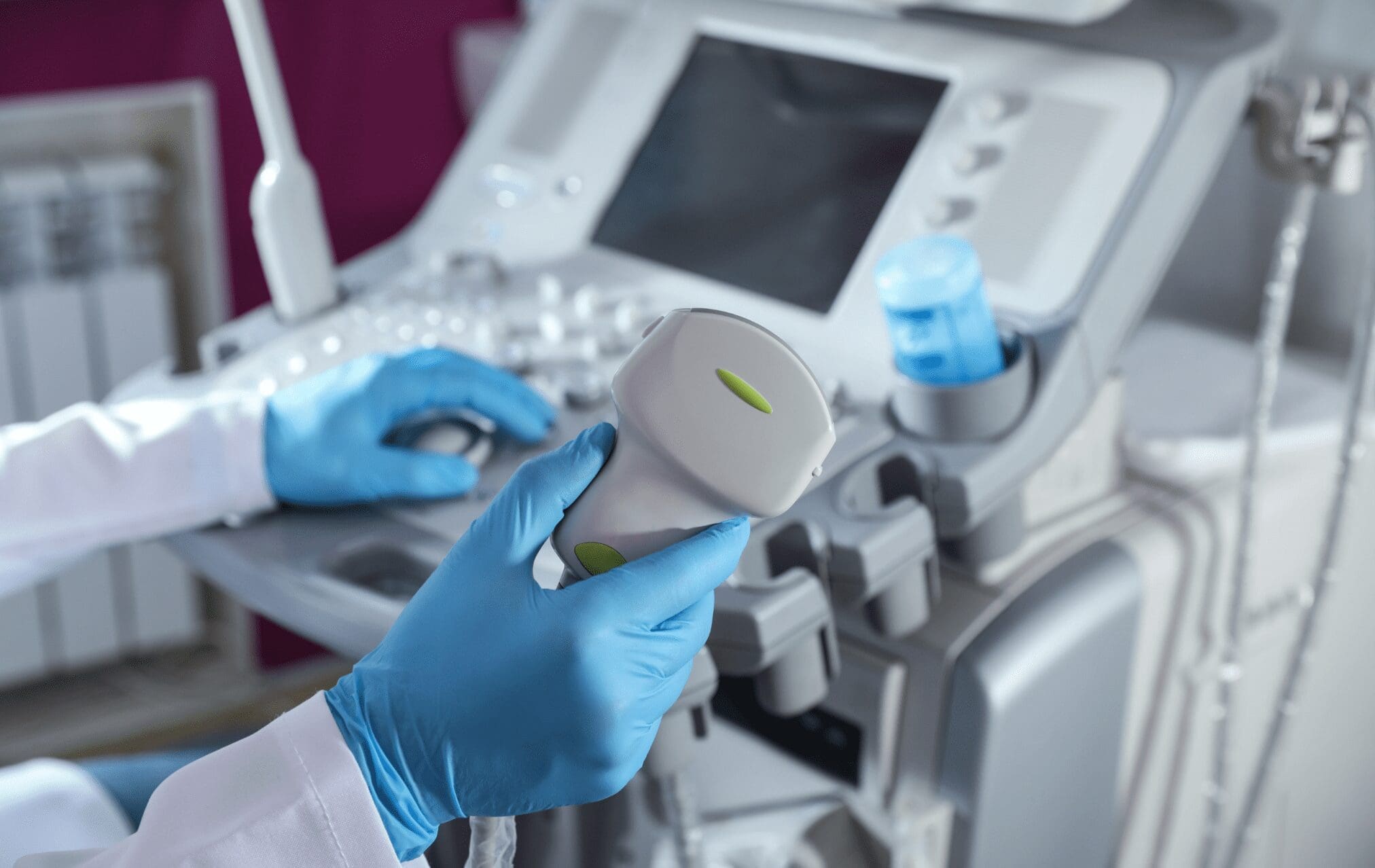 A person utilizes an ultrasound machine