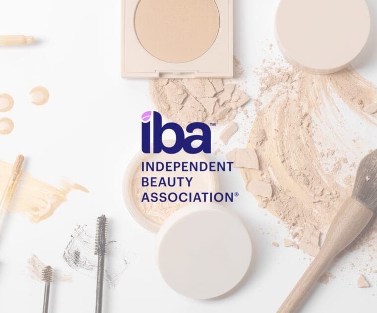 Independent Beauty Association logo over cosmetic products including powder, foundation, and makeup tools.