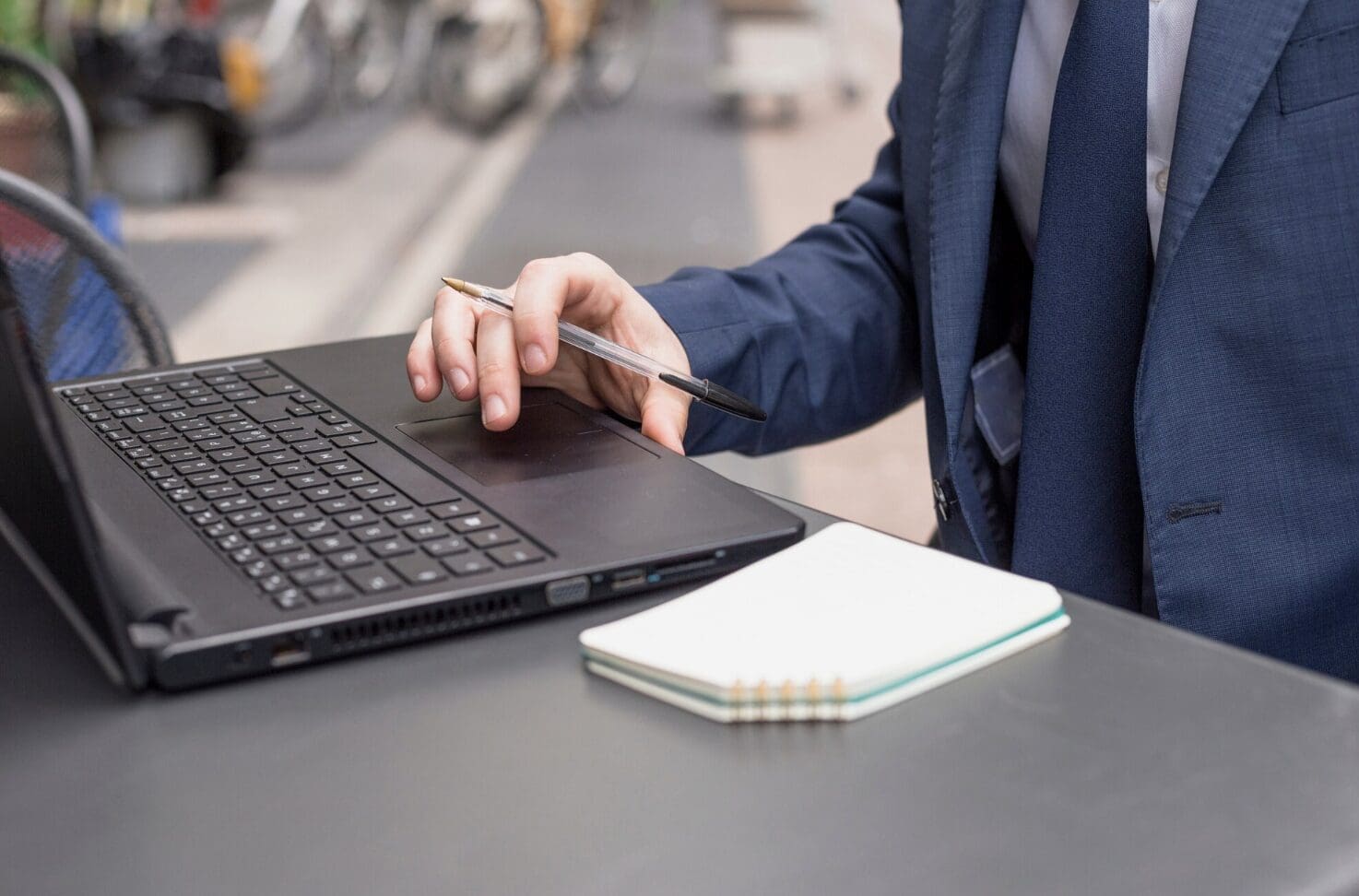 Close up of a man working on a laptop